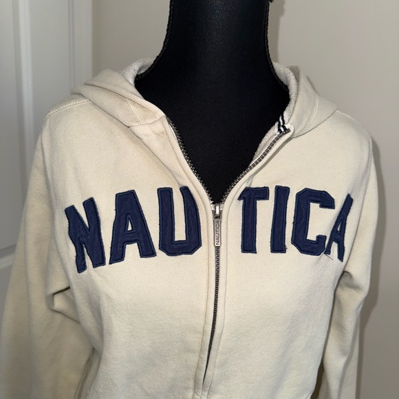 Cream Nautica Hoodie with bold, stitched, navy “NAUTICA” lettering across the ch - Picture 2 of 7